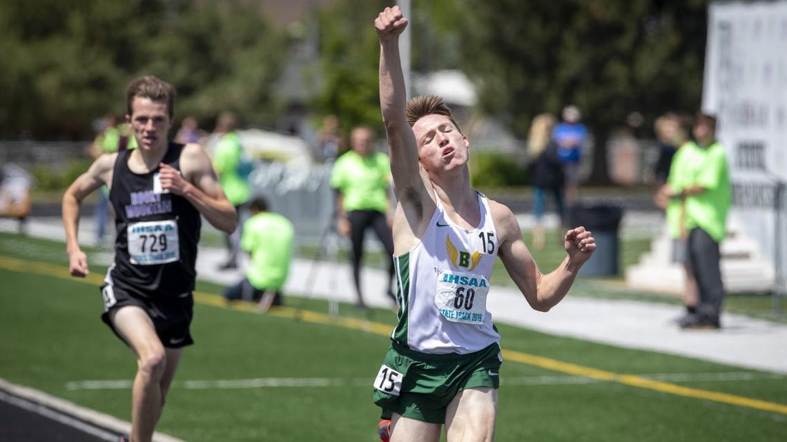 Borah’s Nathan Green throws his hand in the air after winning the 5A 1,600-meter state title at Eagle High in 2019.