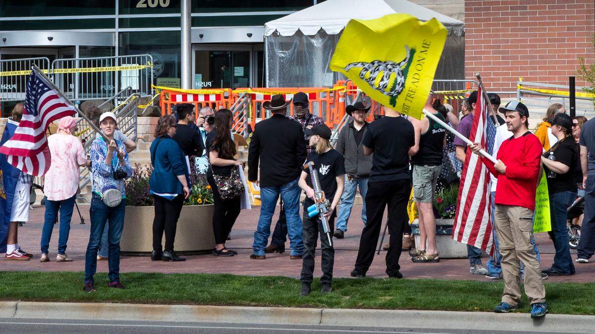 Supporters of Ammon Bundy gather in front of the Ada County Courthouse in April 2021 to protest Idaho Gov. Brad Little’s handling of the coronavirus pandemic.