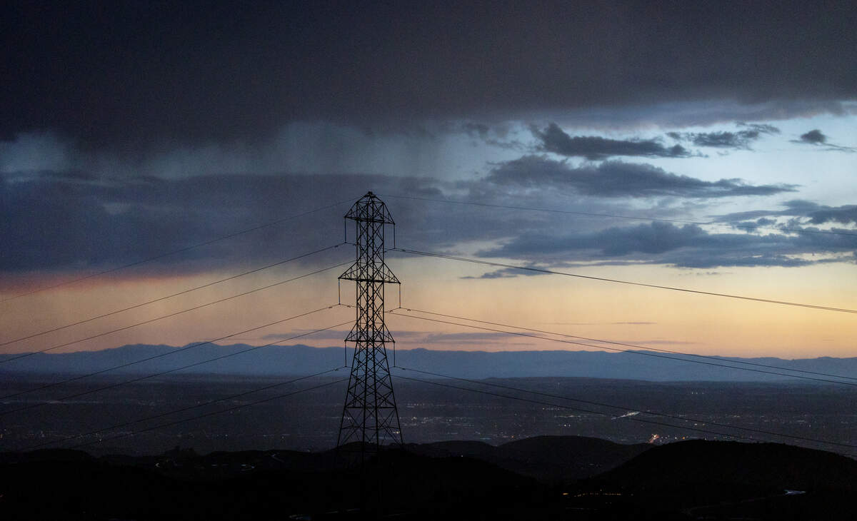 The sun sets behind an electrical transformer and power lines near Bogus Basin Road in Boise on Aug. 22, 2023.