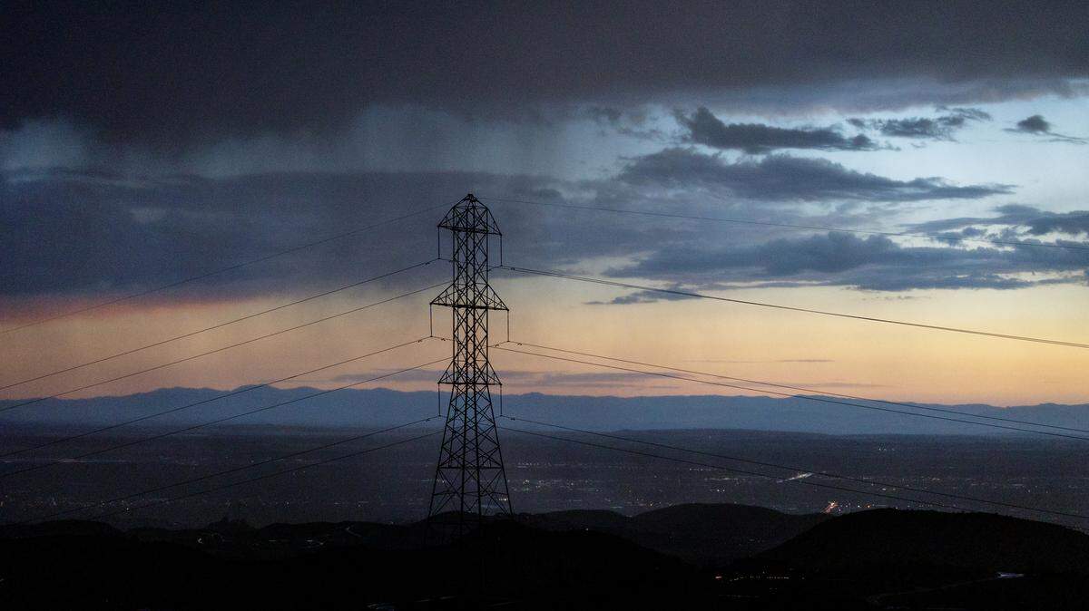The sun sets behind an electrical transformer and power lines near Bogus Basin Road in Boise in August 2023. Idaho Power has warned customers – including those in the Foothills – that it may shut off power to reduce wildfire risks Wednesday evening.