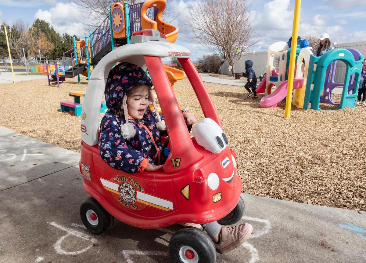 Aurora Coats, 3, plays outside.
