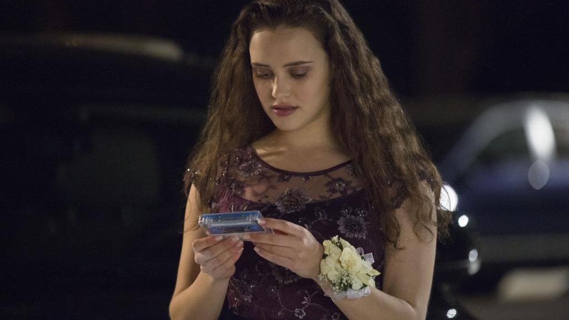 This image released by Netflix shows Katherine Langford in a scene from the series, “13 Reasons Why,” which is about a teenager who commits suicide. The stomach-turning suicide scene has triggered criticism from some mental-health advocates that it romanticizes suicide and even prompted many schools across the country to send warning letters to parents and guardians. The show’s creators are unapologetic, saying their frank depiction of teen life needs to be — unflinching and raw.