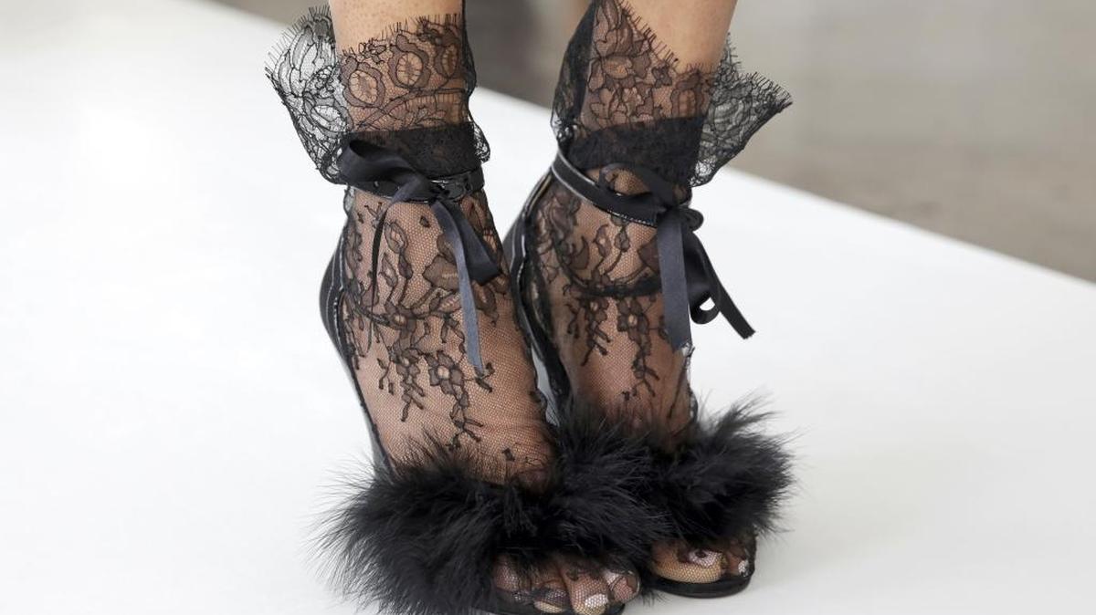 Black is back for brides, especially accessories, such as these shoes from Marchesa, shown at the bridal shows in April in New York City.