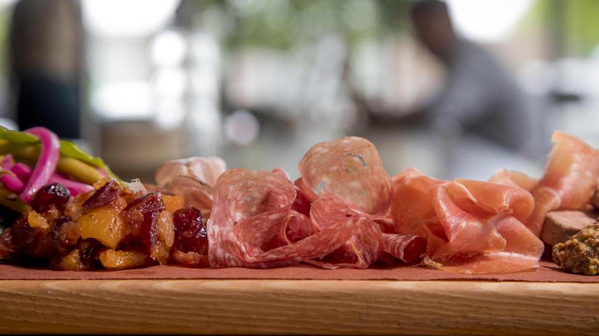 Txikiteo’s Charcuterie Board serves up a variety of regional dry-cured meats from Spain, liverwurst made in Idaho, Olli Salami Toscano from Virgina, Creminelli Coppa from Utah, and Chorizo Cantimpalo from California. The board is filled out with pickled veggies, fruit, whole grain Dijon mustard and bread.