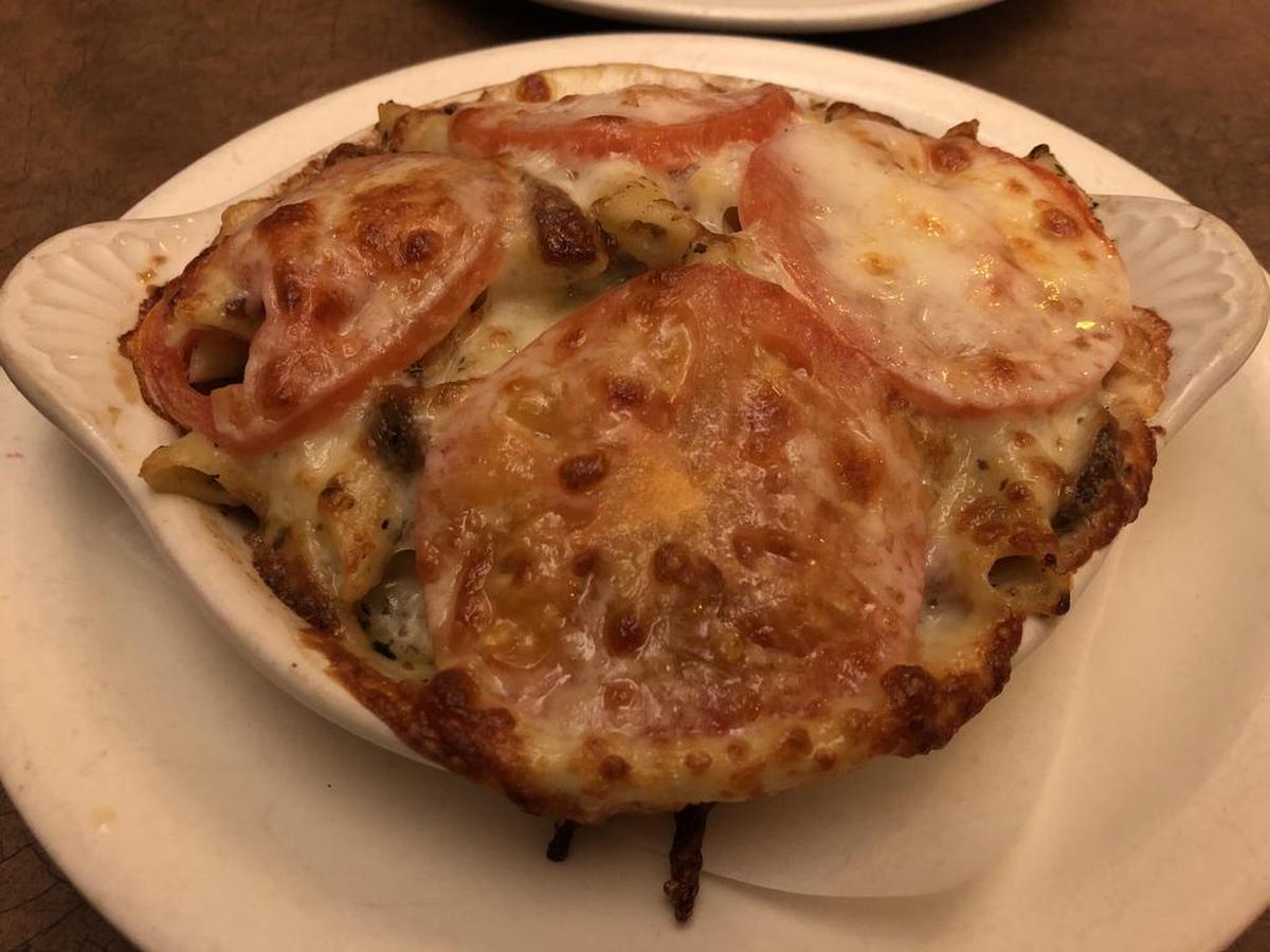 The tomatoes baked into the crust of the mac and cheese at Bacon almost steal the show.
