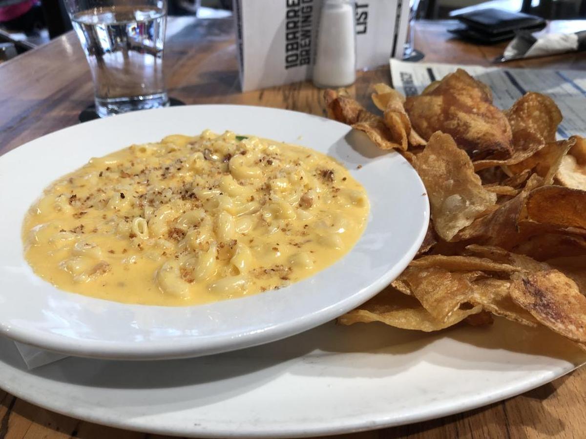 You get a smoked gouda and cheddar sauce at 10 Barrel, not to mention a mound of potato chips.