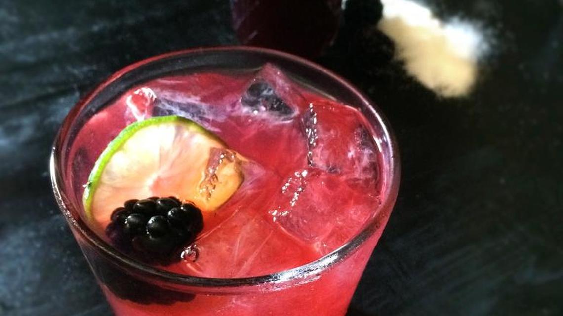 American Colonists used shrubs to flavor cocktails such as this take on the Tom Collins, which uses gin, lemon juice, soda and blackberry shrub.