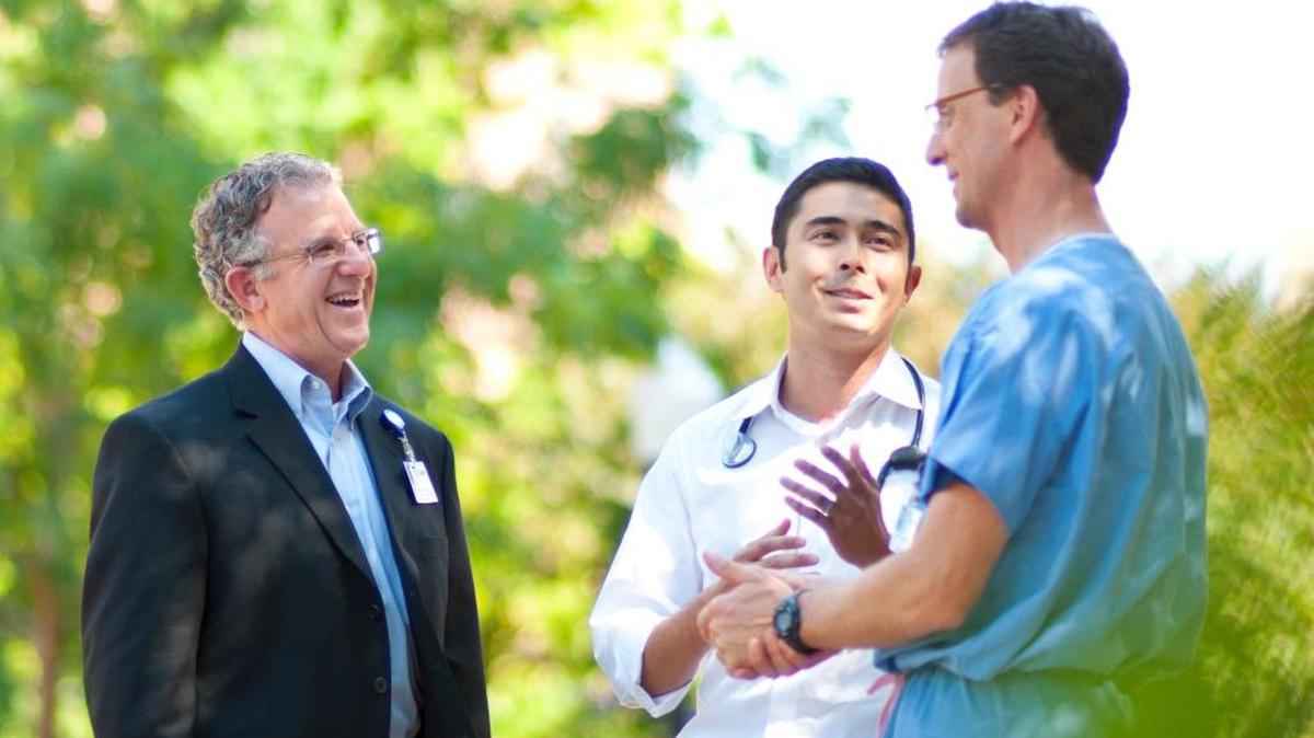 Dr. Dan Zuckerman, center, is the medical director of St. Luke’s Mountain States Tumor Institute. He writes about how doctors walk a fine line between honesty and compassion when talking with patients.