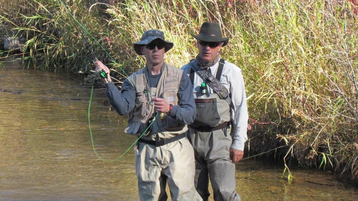 Jeremy Kitzhaber casts a line as Idaho 2 Fly guide Alex Klokke looks on.