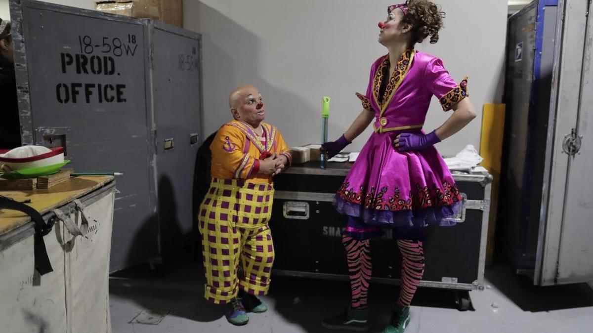 Clowns Gabor Hrisafis, left, and Beth Walters talk in a hallway of the Dunkin Donuts center before a performance May 4 in Providence, R.I. “The Greatest Show on Earth” is about to put on its last show on earth. For the performers who travel with the Ringling Bros. and Barnum & Bailey Circus, its demise means the end of a unique way of life for hundreds of performers and crew members.