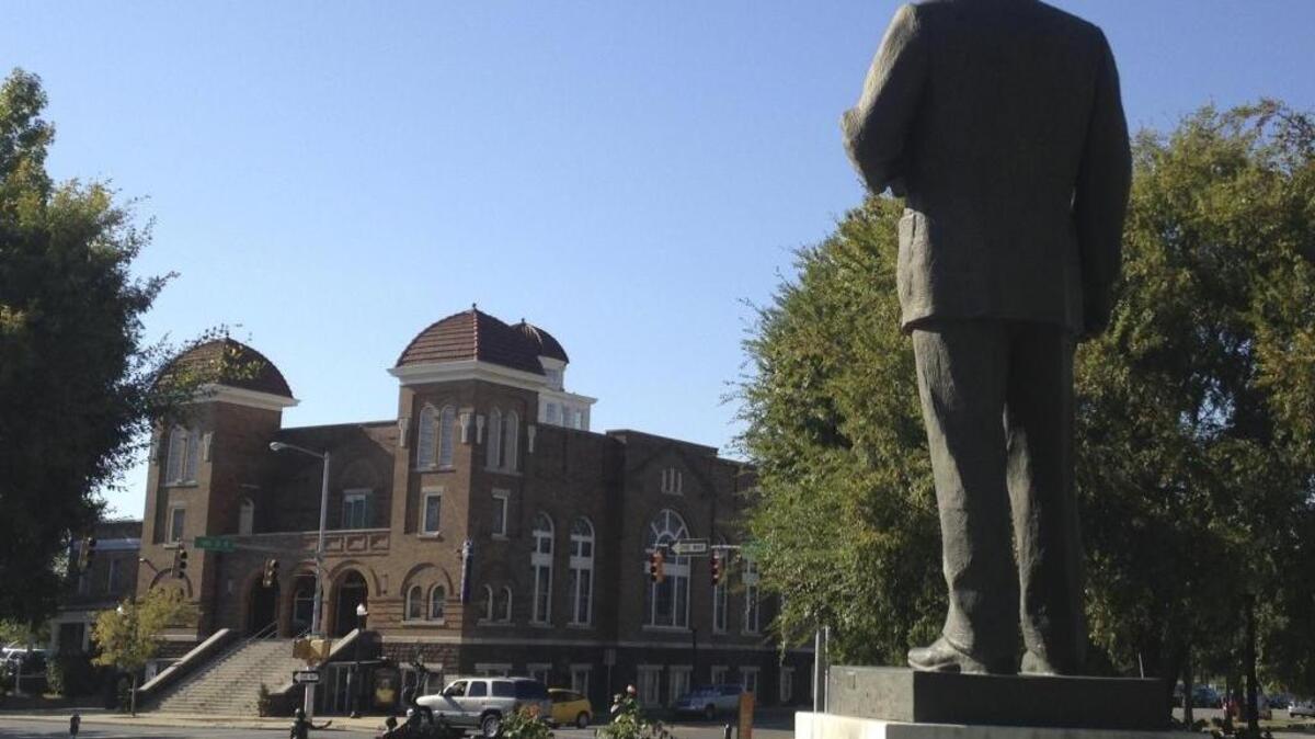 A statue of Rev. Martin Luther King, Jr. overlooks the 16th Street Baptist Church in Birmingham, Ala. Monday, Jan. 16, is Martin Luther King, Jr. Day.