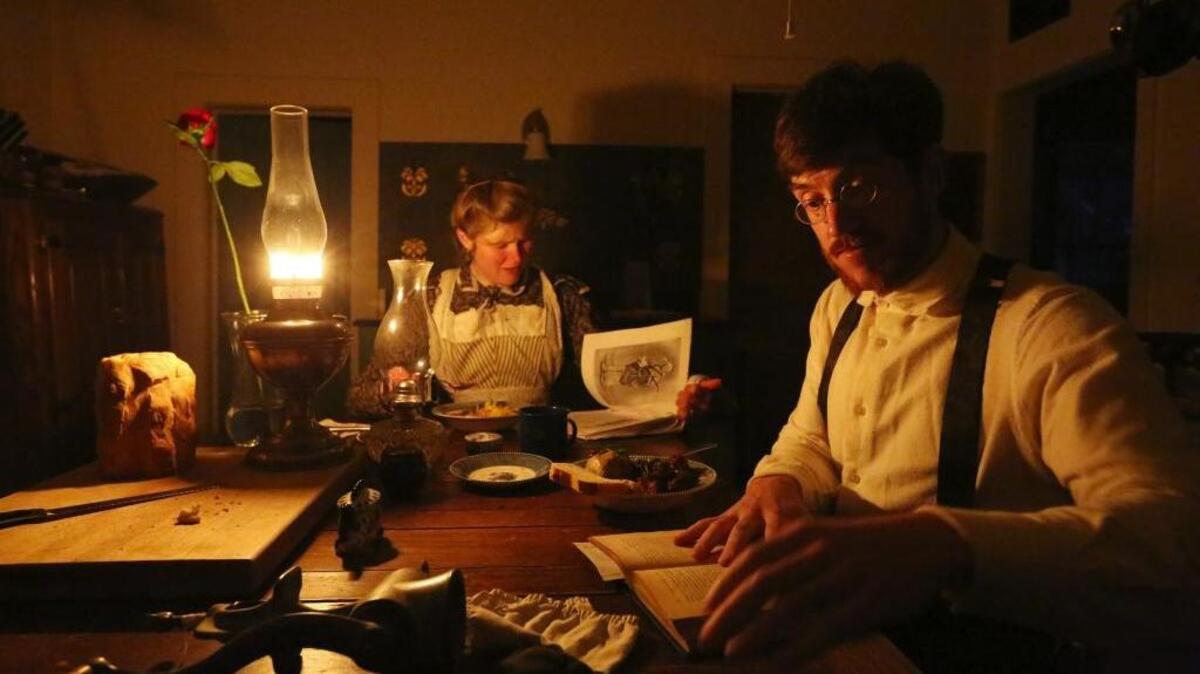 Sarah and Gabriel Chrisman, of Port Townsend, Wash., dine by lamplight.