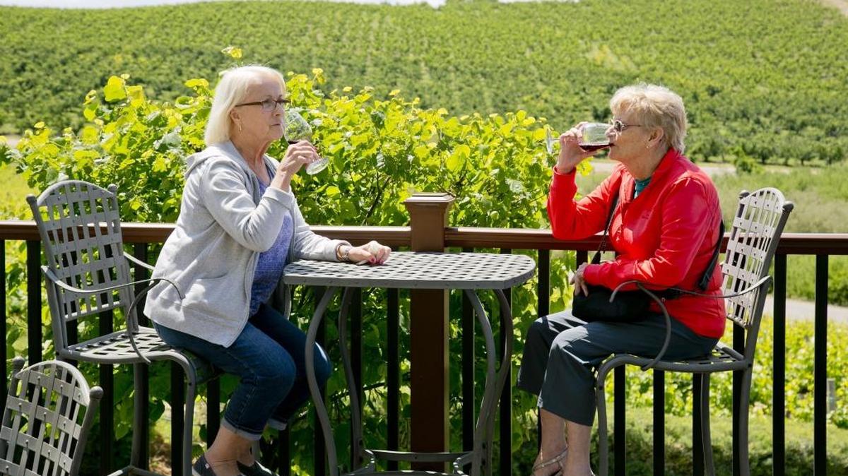 Helen Allen (left) and Robyne Houchin enjoy wine on the outside patio area of Ste. Chapelle winery in Sunnyslope in May. Robyn, who is from Australia, was visiting her friend Ellen, who lives in Idaho.