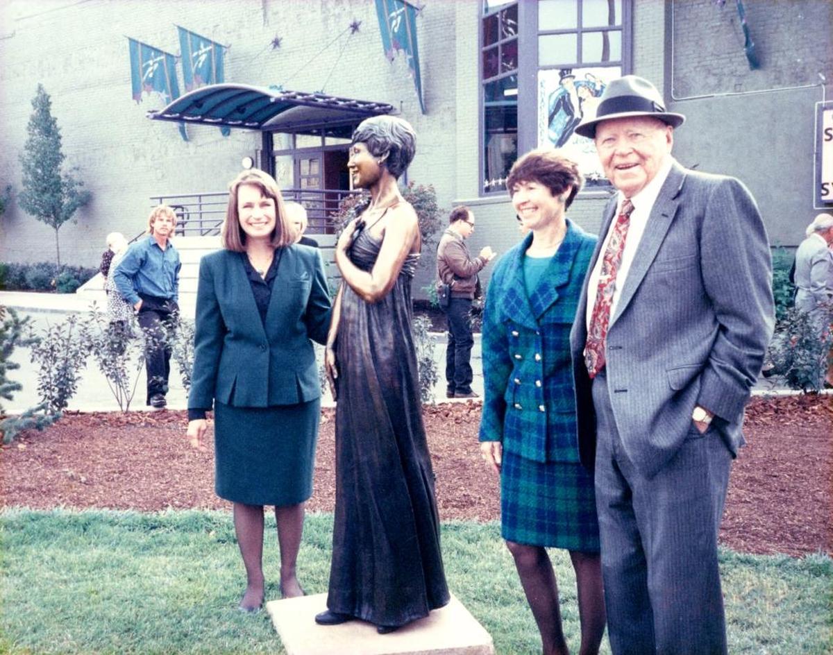 Esther and J.R. Simplot at the dedication of her statue at the Esther Simplot Performing Arts Academy at 9th and Myrtle streets in 1993. Turning a furniture warehouse into an arts center is her greatest achievement, she says. The couple is pictured with sculptor Ann LaRose, who made the statue of Esther that stands at the entrance of the academy.