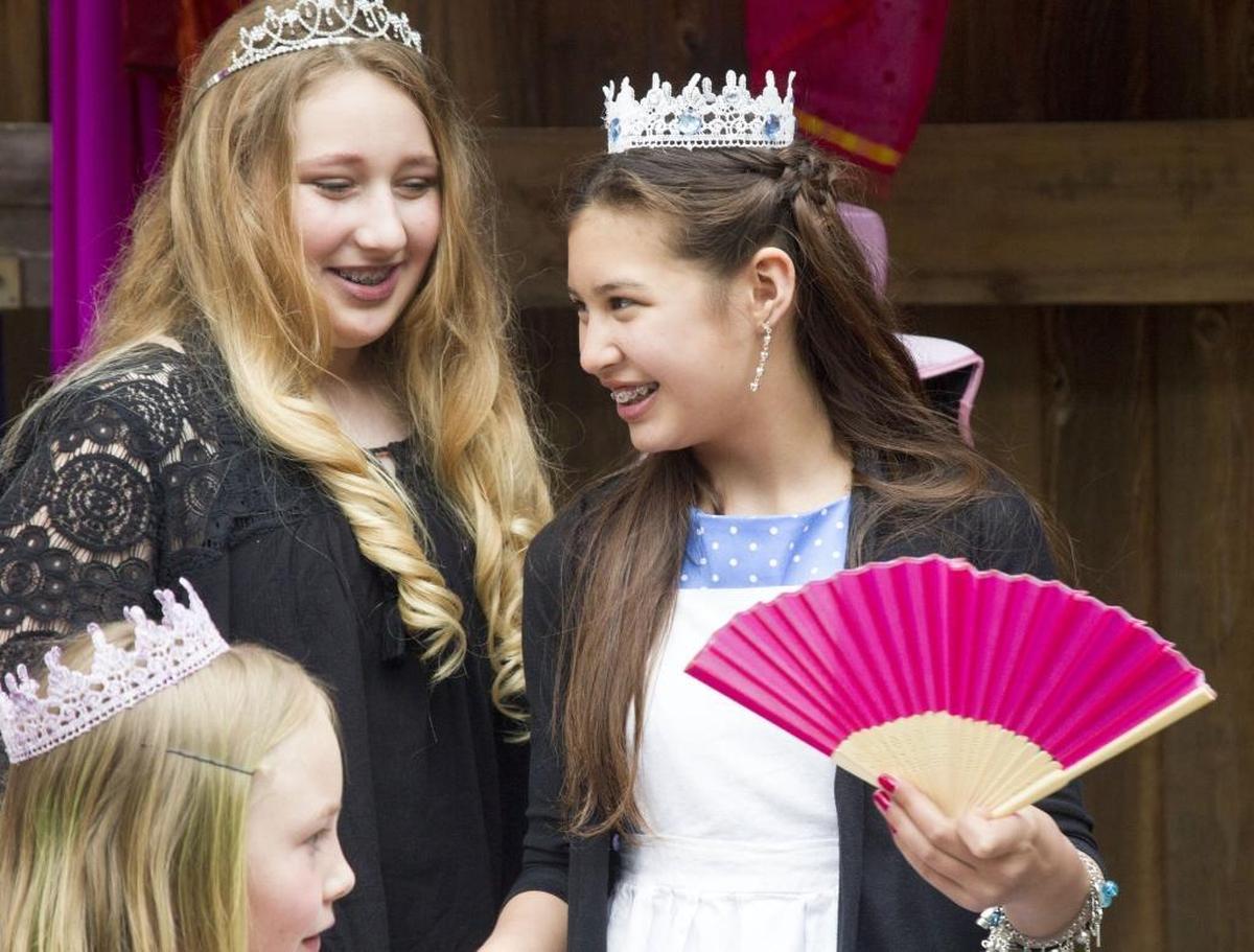 Isabella Valley, 12, right, talks to her friends at the annual tea party.