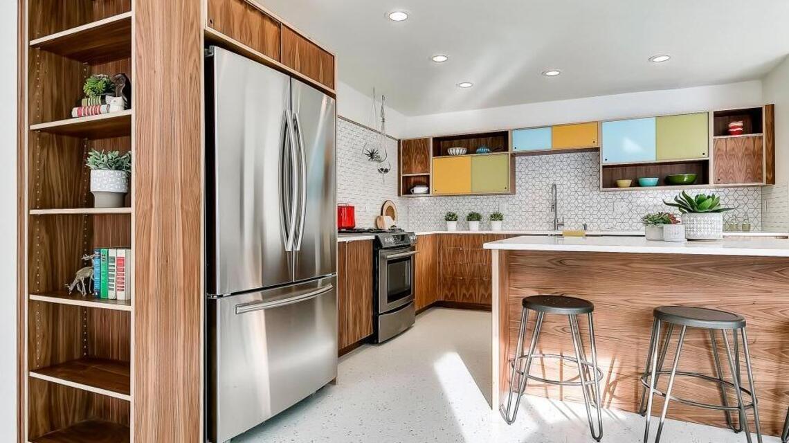 A midcentury flip updates a kitchen with color, open spaces and classic touches