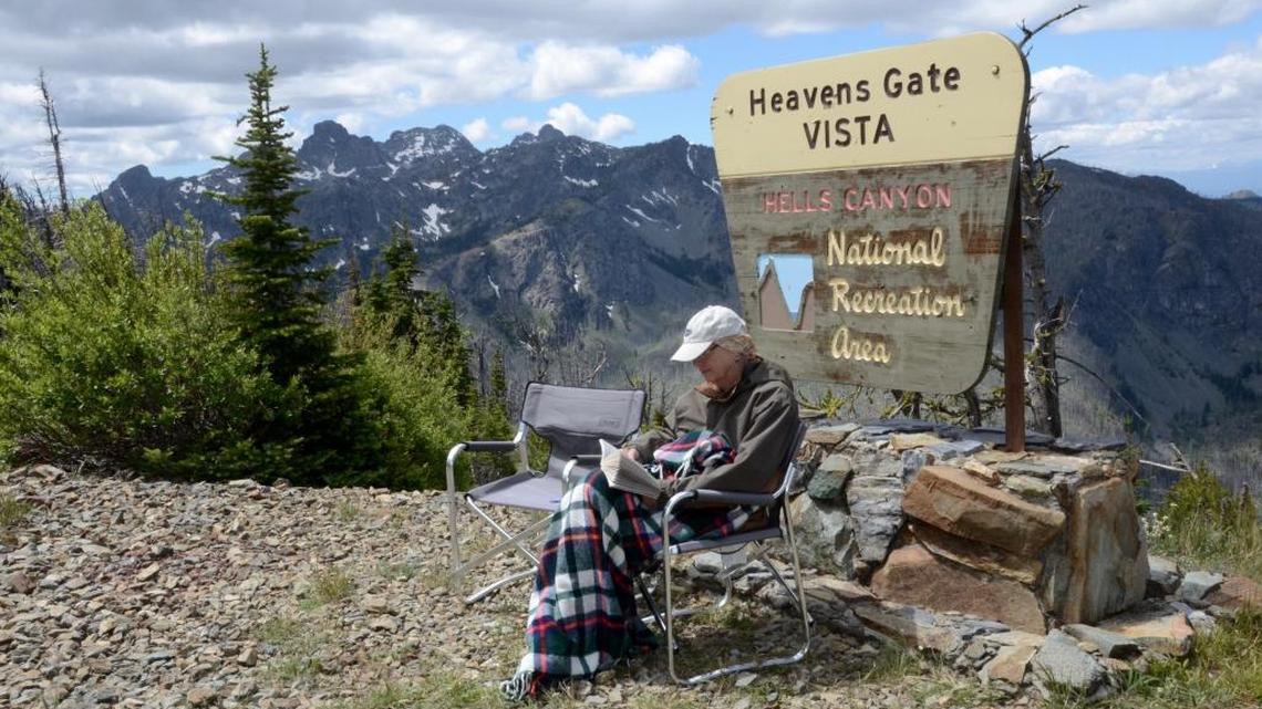 Sharon Dowdle, of Meridian, enjoys the cool breeze and a book near Heaven’s Gate Lookout. The high-elevation vista was brisk in the low 60s during a late July day while the Treasure Valley sweltered in the 90s.