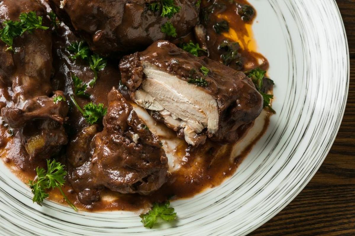 Coq au Vin is typically served with pearl onions or sauteed mushrooms, but its sauce is so luxe that it goes great with mashed or roasted potatoes, polenta or fresh bread.