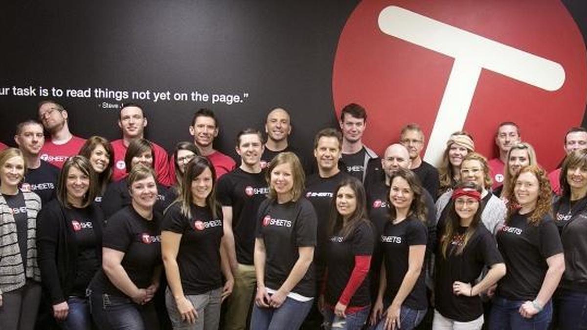 TSheets CEO Matt Rissell, in the center in back, with 39 other employees (some not shown) in April 2015. The staff size has since grown more than sixfold.