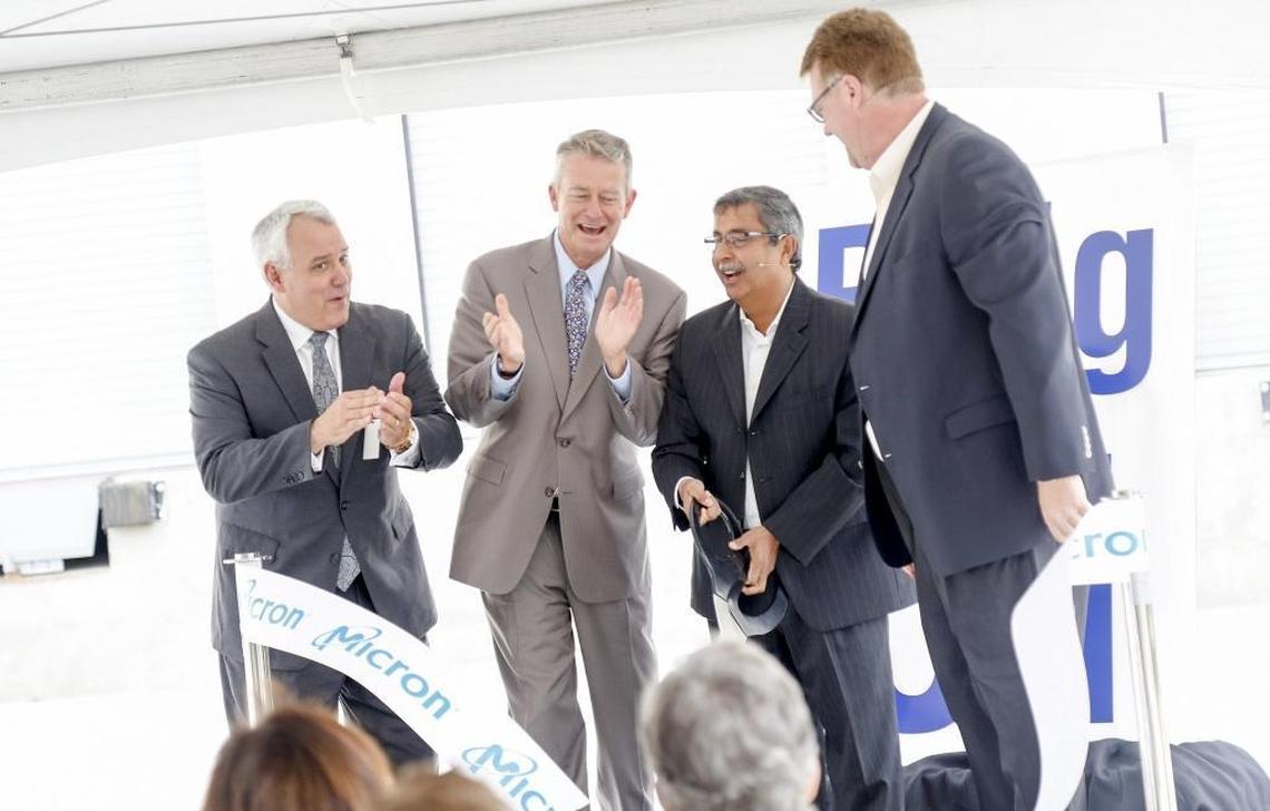 A ceremony marked the August opening of the four-story, $200 million Building 51, a focal point for developing new semiconductor-manufacturing processes for a dozen Micron plants worldwide. From left: Boise Mayor David Bieter, Idaho Lt. Gov. Brad Little, CEO Sanjay Mehrotra and Scott DeBoer, Micron’s executive vice president of technology development.