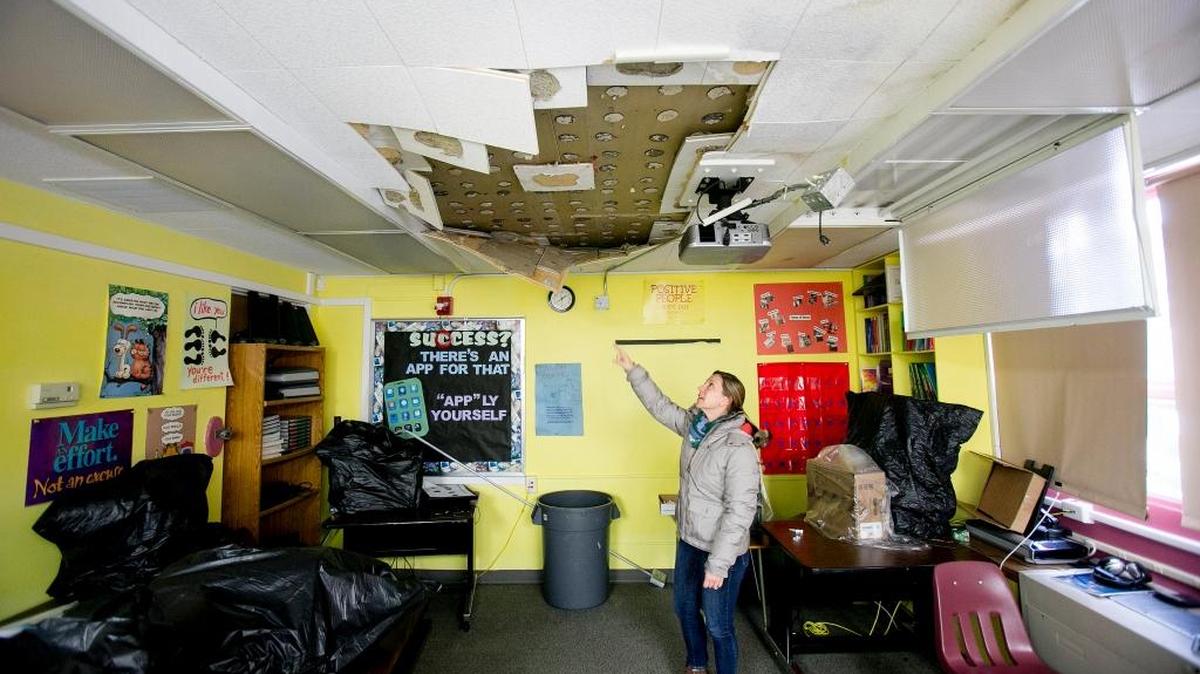 Hillary Betz, director of development for the Salvation Army’s Boise Corps Office, points out weather-related water damage that developed Jan. 8 at the Salvation Army’s Marian Pritchett Booth site in the North End.