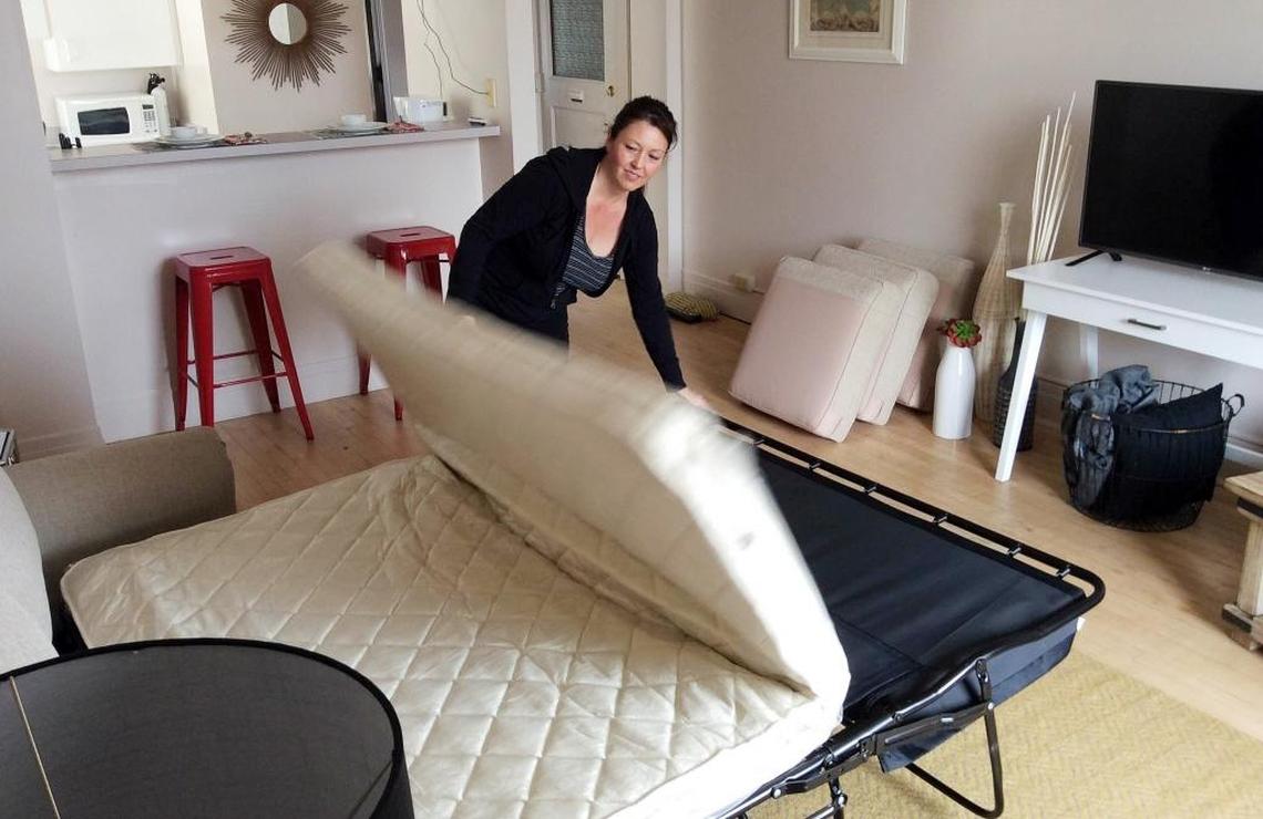 Vacasa housekeeper Paula Davis gets a downtown Boise apartment ready for short-term vacation rentals in 2015.