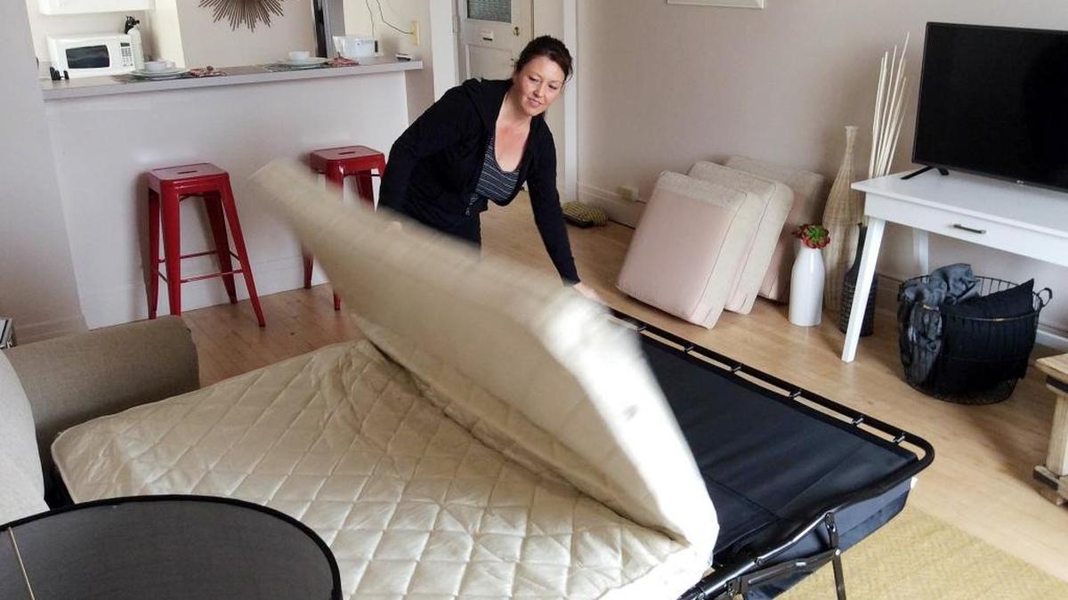 Vacasa housekeeper Paula Davis gets a Downtown Boise apartment ready for short-term vacation rentals in 2015.