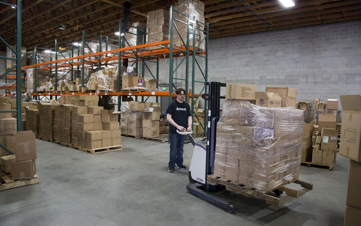 R’Jay Graham moves a shipment of product in Ninja Division’s warehouse in this photo from 2016.