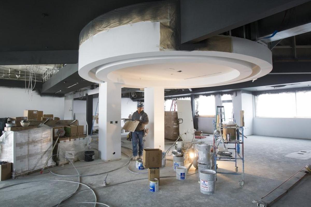Construction crews work to finish the 92-room hotel.