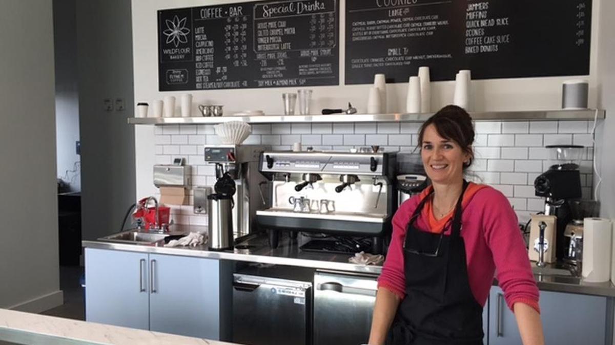 Mary Cogswell has run her business Wildflour Bakery out of her North End garage for two decades. Her new Garden City storefront is three times larger.
