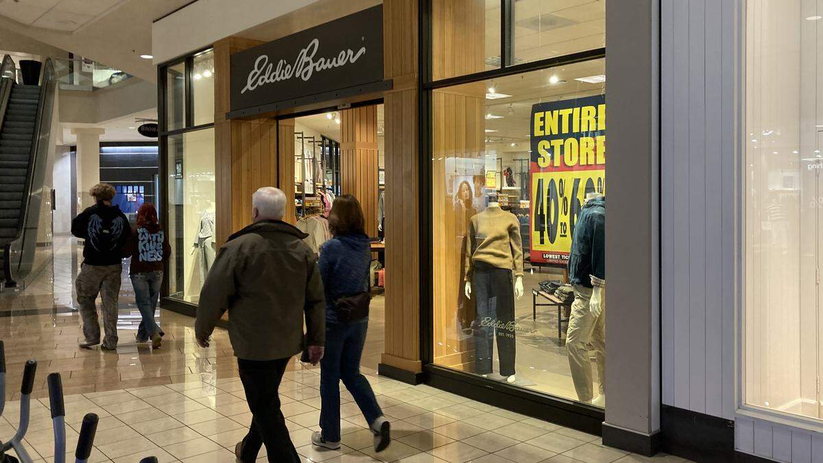 Shoppers pass the Eddie Bauer store at Boise Towne Square. There may be a chance that the store could stay open if a buyer is found. 