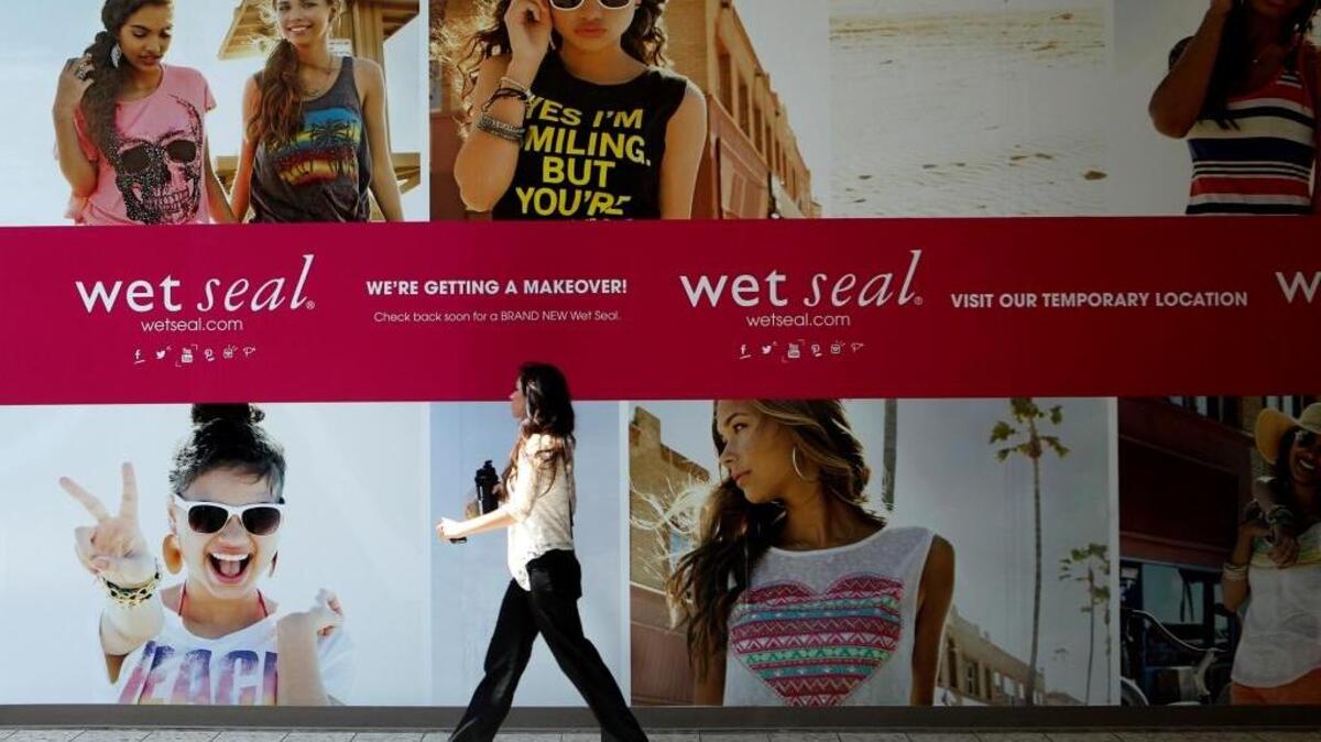 In this July 2, 2013, file photo, Shianne Penoli walks past the future location of Wet Seal at the Mt. Shasta Mall in Redding, Calif.