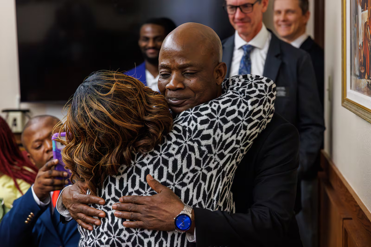Bishop Denis Akulu hugs his wife, Esther Akulu, on Sunday after the Treasure Valley Ward (Swahili) was created in the LDS church’s Boise, Idaho, Stake. |