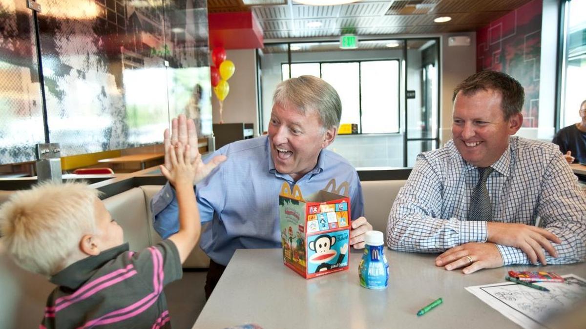 Dick Darmody, center, and his son Rick, share a laugh with two-year-old Hudson Dunn at the grand reopening of the McDonald’s on Chinden Boulevard in August 2012. The Darmody family owns and operates McDonald’s restaurants in the Treasure Valley.