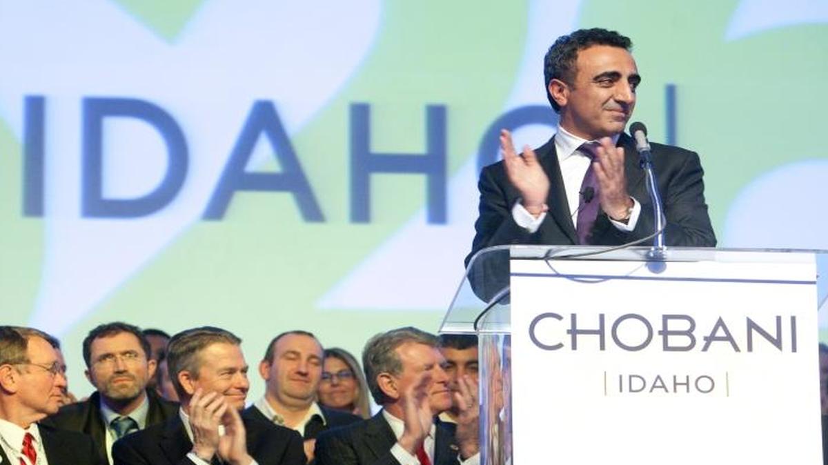 Hamdi Ulukaya, standing at right, during the grand opening of Chobani’s yogurt plant in Twin Falls in 2012.