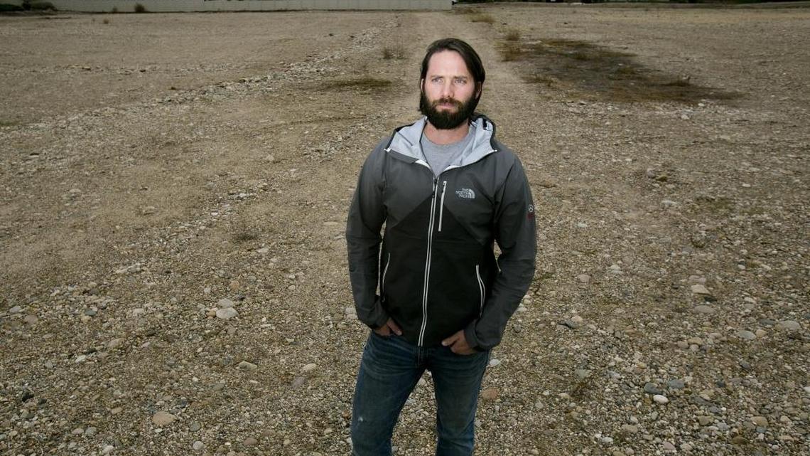 Chance Hobbs, a partner in VCD, hopes to build Moon Valley Apartments in this 2.7-acre empty lot. Many residents of the neighboring Pinewood Lake subdivision behind him oppose the project. “They are saying, ‘Not in our backyard,’ ” Hobbs said. “If I moved the project to a 9-acre lot another 200 yards down the road, they wouldn’t care.”