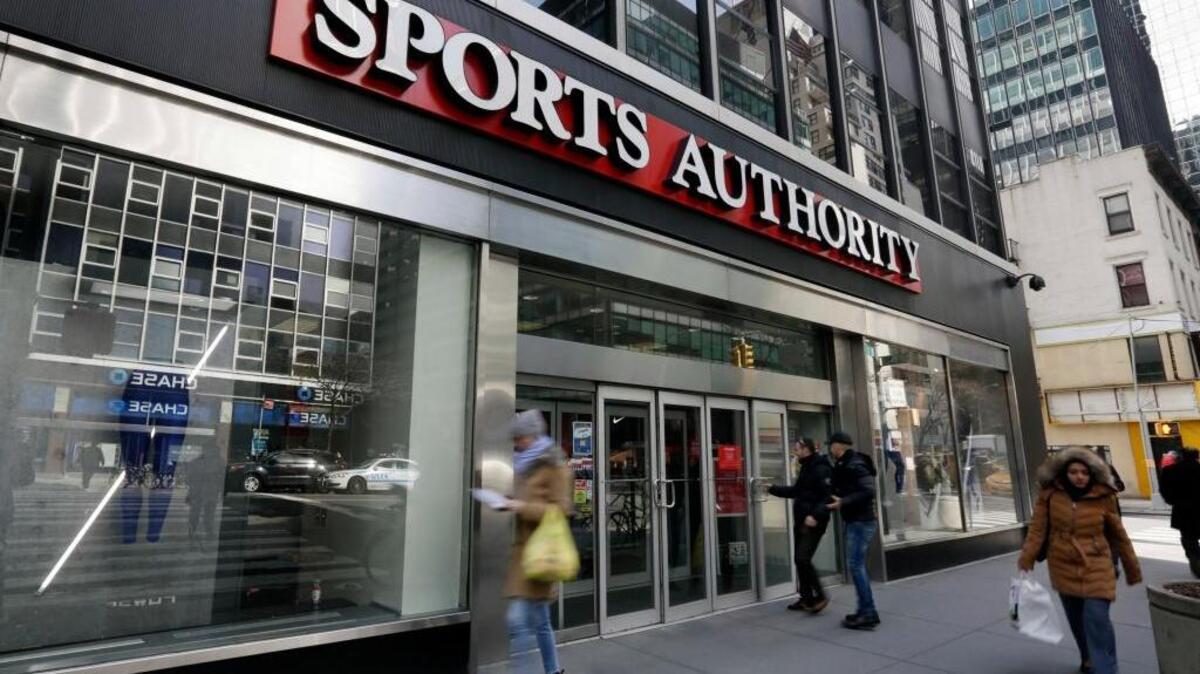 People enter a Sports Authority store in New York. Sports Authority is filing for Chapter 11 bankruptcy protection. The Englewood, Colo., company has 463 stores in 41 states and Puerto Rico.
