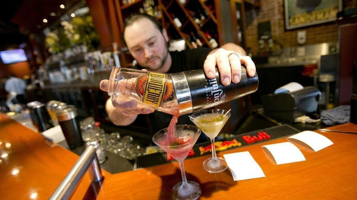 Only a handful of employees at Boise-based Bardenay would qualify for either overtime pay or an overall salary raise under new rules issued Wednesday by the Obama administration. Most staffers are already hourly or paid more than $47,500 a year. “One of the nice things ... is that they give us until Dec. 1,” said Bardenay owner and National Restaurant Association board member Kevin Settles, after seeing the final rule Wednesday. “It's enough time to actually give it some real thought and understand it a little better.” Here, Craig West makes drinks during a lunch hour in February.