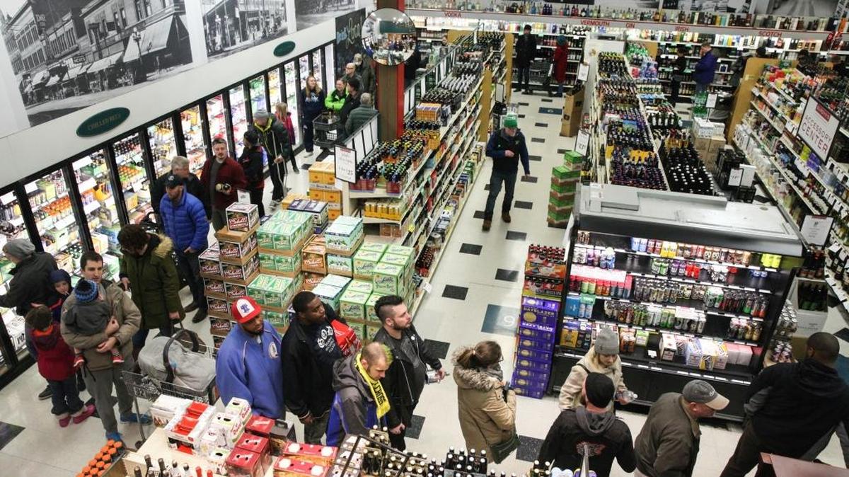 Customers waiting for cashiers meander inside of The Surdyk’s liquor store in Minneapolis on Sunday, March 12. The store has opened for business even though Minnesota’s new Sunday liquor-sales law does not take effect until July.