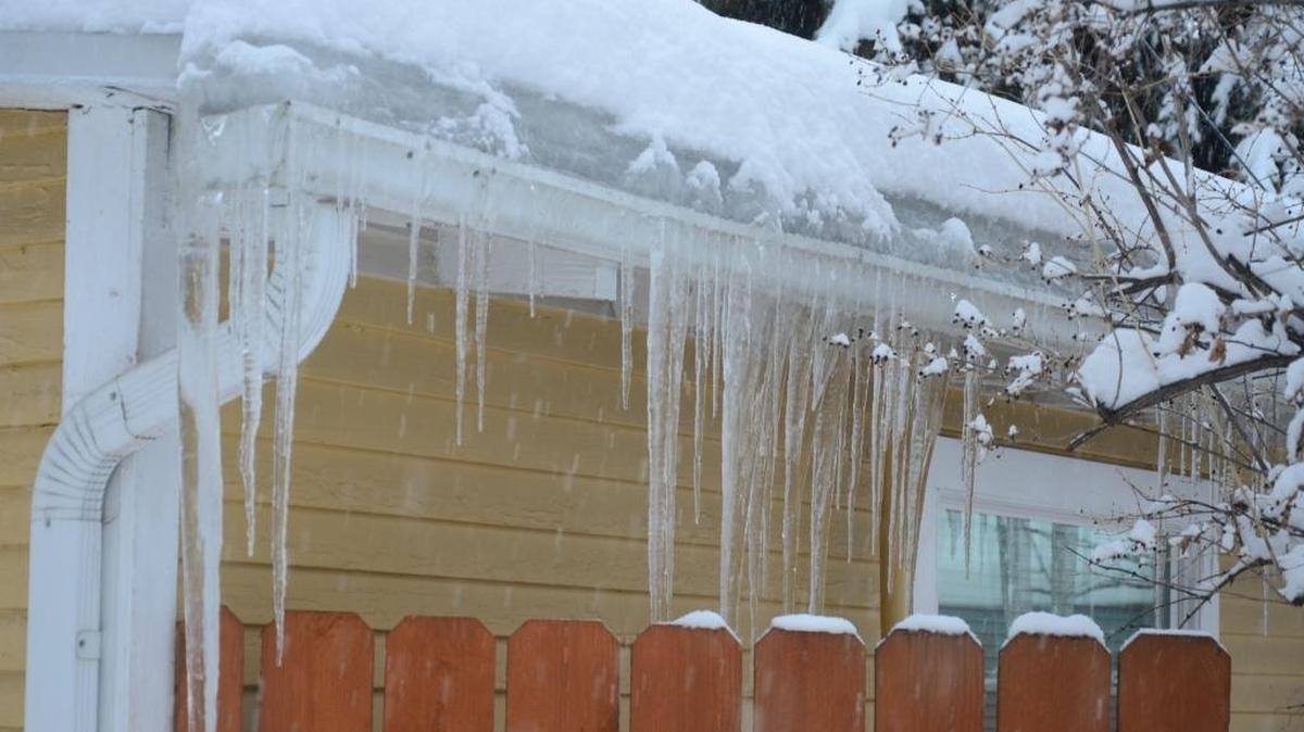 An ice dam formed this week between the edge of the roof and the gutter at this home in Boise’s West End. Water from melting snow could seep underneath shingles, causing damage and possibly a leak.
