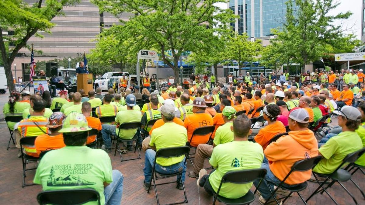 Workers for Meridian general contractor Engineered Structures Inc. listen at a fall-prevention workshop in May on the Grove Plaza. Ada County’s low unemployment rate contributes to a shortage of local workers in construction and some other fields.
