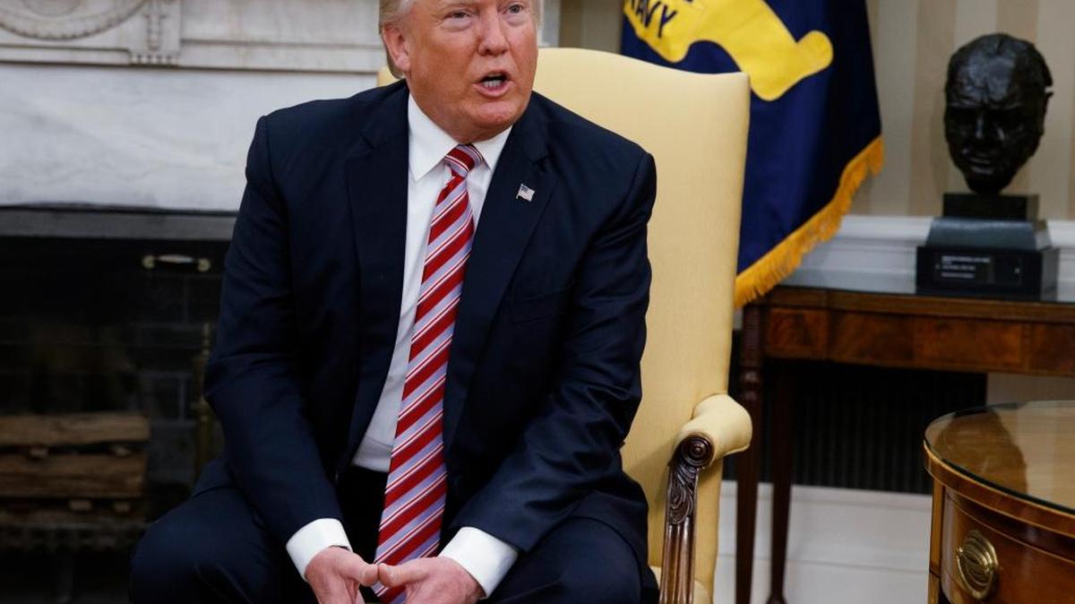 President Trump told the Economist that it would be worth increasing the nation’s debt further to stimulate the economy. Trump talks to reporters May 10 in the Oval Office.