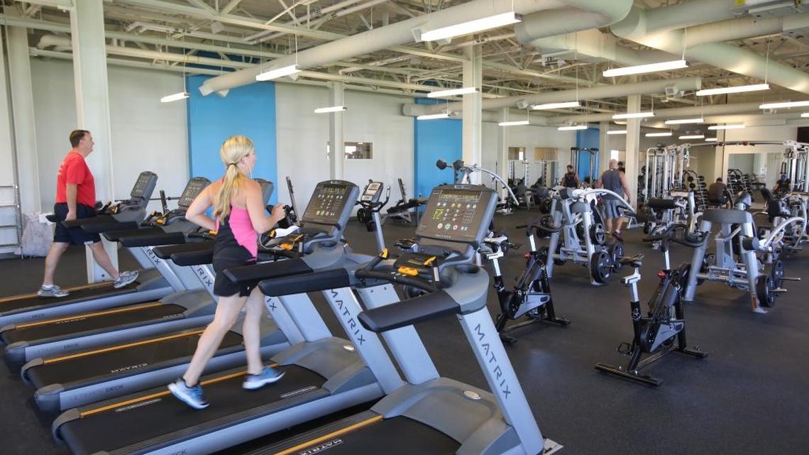 Employees in the gym of BodyBuilding.com's Boise headquarters. If you need a gym and don’t have one like this at work that meets your needs, review the BBB’s tips.