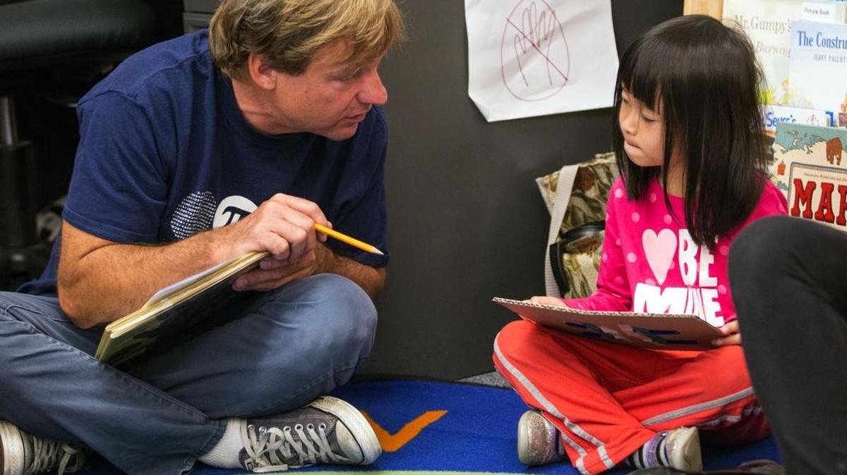 Could Goldman Sachs help pay for public preschools? Minnesota is considering an experiment with social-impact bonds similar to one Salt Lake City is already trying. Here, math coach Bryan Street works with a pre-K student in 2015 at South Shore School in South Seattle, Washington.