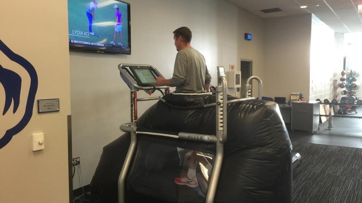 Balloons that lift athletes up make it seem like they are walking on the moon, but they’re actually on antigravity treadmill.