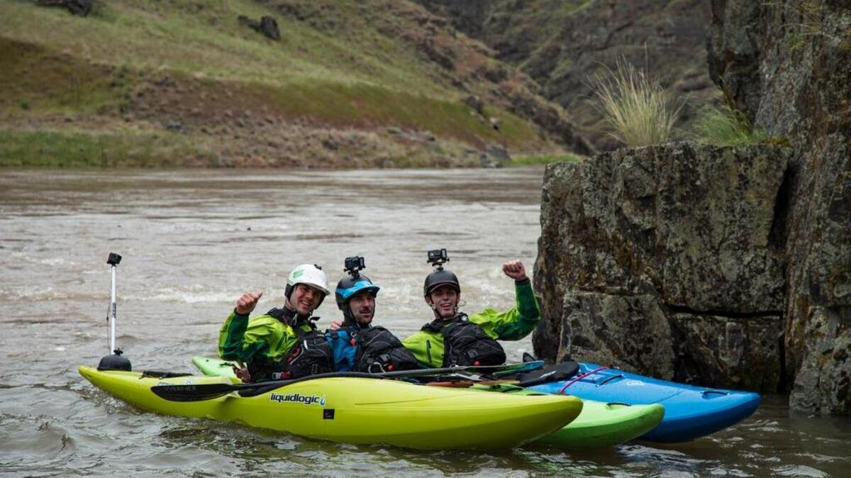 From left, Kyle Smith, Mike Bond and Sam Wells celebrate arriving at the confluence of the Salmon and Snake rivers.