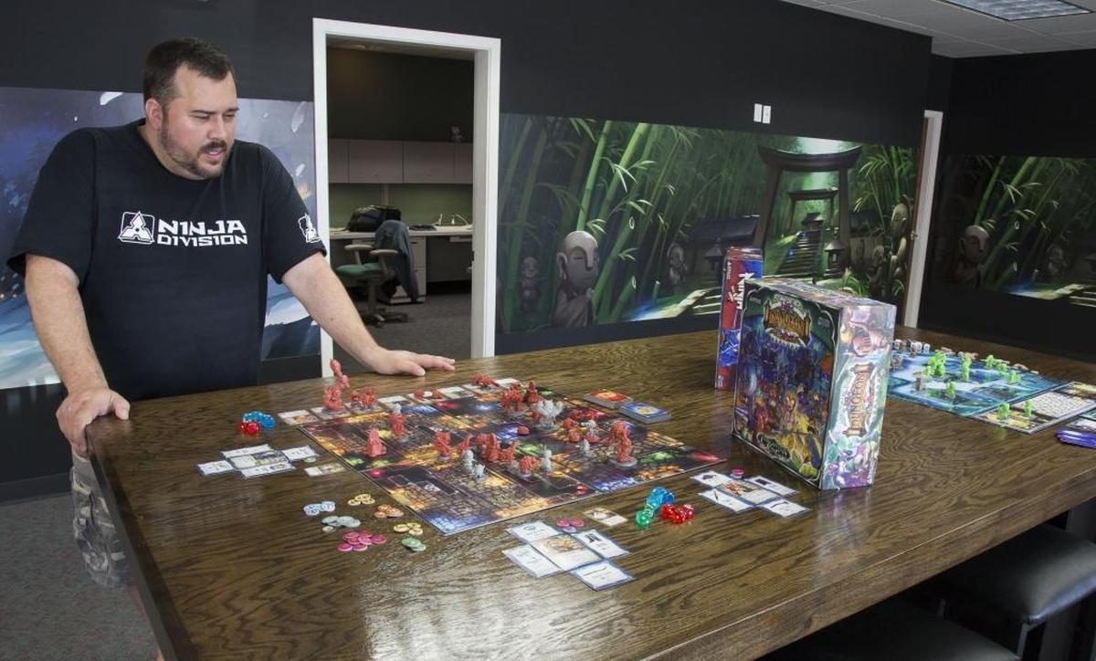 Ninja Division, a small game maker in Garden City, grew revenues to $5 million in 2015. Four Kickstarter campaigns brought in $3.3 million, helping to pay manufacturing costs. In this Statesman file photo, Creative Director John Cadice shows off the best seller, “Super Dungeon: Explore.”