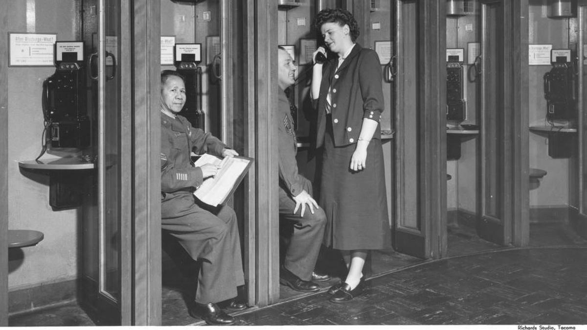 Pay phones used to be a popular way for people to make telephone calls away from home. Most phone booths have disappeared as more and more people carry cell phones. The same trend has led to people canceling landline service at home, which has cut the revenue collected from a surcharge that helps subsidize landline service in parts of rural Idaho. This 1957 photo was taken at Fort Lewis in Washington state by the Richards Studio of Tacoma.