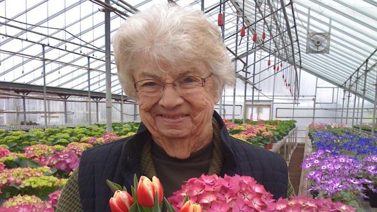 Wilma “Dody” Edwards holds tulips and hydrangea flowers at Edwards Greenhouse.