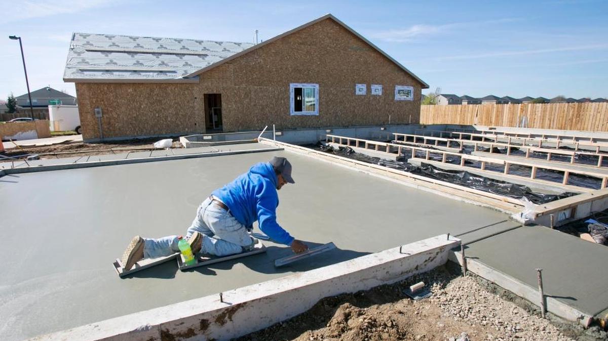 A worker helps build a home in Meridian’s Kingston Point subdivision last year.